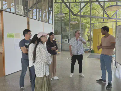PAG Lab members presenting their research posters to the University of Queensland delegation at Dürnast.