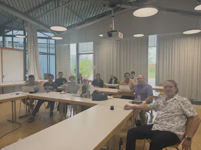 Seminar-room discussion on remote sensing for crop monitoring and modelling during the Dürnast visit.