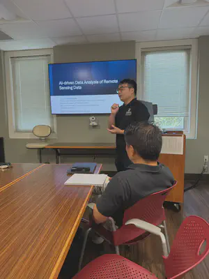 Prof. Tao Liu presenting during the joint seminar.