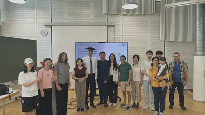 The examination committee and lab members celebrate with Ali