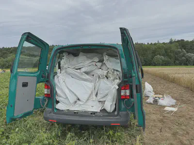 Green van full of sample sacks